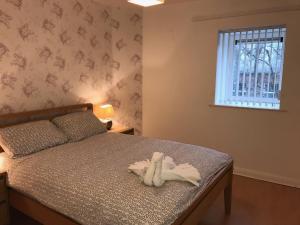 A bed or beds in a room at Solihull centre apartments