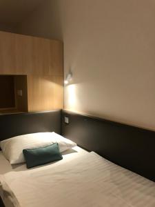 Posteľ alebo postele v izbe v ubytovaní Hotel & Restaurant Graf
