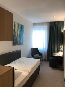 Posteľ alebo postele v izbe v ubytovaní Hotel & Restaurant Graf