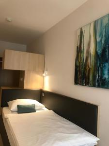 Posteľ alebo postele v izbe v ubytovaní Hotel & Restaurant Graf