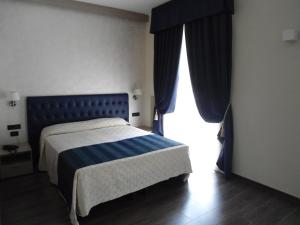 Postel nebo postele na pokoji v ubytování Hotel Continental