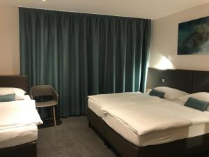 Posteľ alebo postele v izbe v ubytovaní Hotel & Restaurant Graf