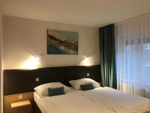 Posteľ alebo postele v izbe v ubytovaní Hotel & Restaurant Graf