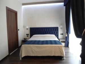 Postel nebo postele na pokoji v ubytování Hotel Continental