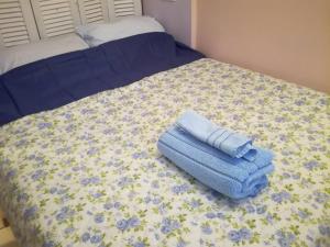 Кровать или кровати в номере LITTLE HOUSE ON THE ROOFTOP