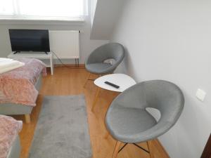 TV a/nebo společenská místnost v ubytování Apartament Esja