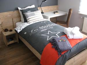 En eller flere senge i et værelse på BCozy vakantievilla Belgie