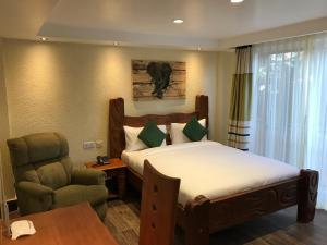 Tempat tidur dalam kamar di Progressive Park Hotel