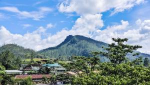 a view of a town with a mountain in the background at Top View in Hatton