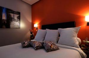 Krevet ili kreveti u jedinici u okviru objekta Le Sphinx Boutique Hôtel