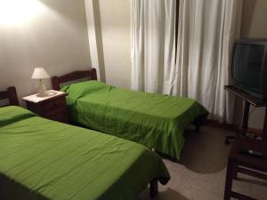 Ένα ή περισσότερα κρεβάτια σε δωμάτιο στο El ciprés