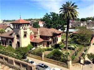 a large house with cars parked in front of it at Elena Hotel Boutique in Azul