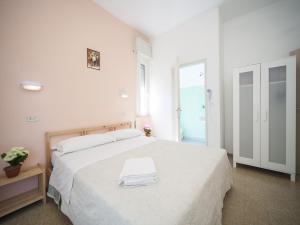 Posteľ alebo postele v izbe v ubytovaní Hotel Colombo