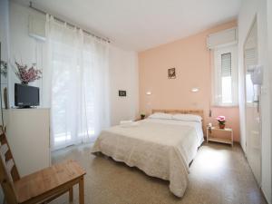 Posteľ alebo postele v izbe v ubytovaní Hotel Colombo