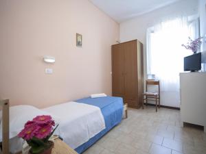 Posteľ alebo postele v izbe v ubytovaní Hotel Colombo