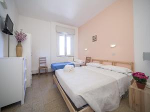 Posteľ alebo postele v izbe v ubytovaní Hotel Colombo