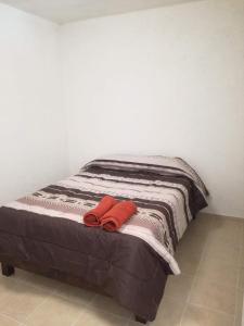 En eller flere senge i et værelse på Hotel Posada Yauhtli