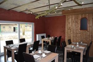 a dining room with wooden tables and chairs at Holiday Home Koolhof in Nieuwpoort