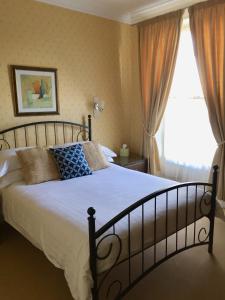 a bedroom with a large bed and a window at Westcliff in Seascale