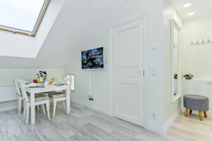 TV a/nebo společenská místnost v ubytování Tallinn City Harbour Apartments