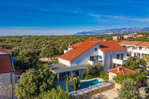 an aerial view of a house with a swimming pool at After All in Mandre