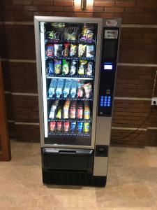 a vending machine filled with drinks and sodas at Hotel Nadal in Lleida