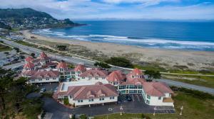 an aerial view of a beach and buildings at Pacifica Beach Hotel in Pacifica