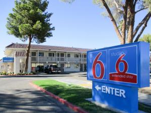 a blue sign in front of a building at Studio 6-Barstow, CA in Barstow