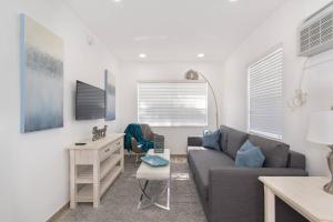 a living room with a couch and a table at Trendy 1BR w Parking Space Walk to the Beach 8 in Hollywood