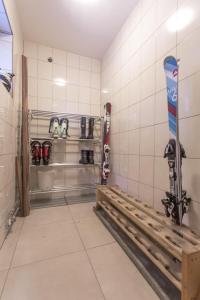 a room with a snowboard on a rack in a room at Willa Skalny Potok 605-077-100 in Zakopane +69 photos