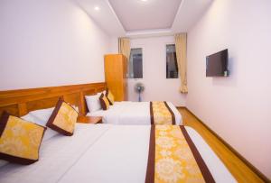 Katil atau katil-katil dalam bilik di Hồng Tùng Hotel