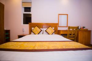Katil atau katil-katil dalam bilik di Hồng Tùng Hotel