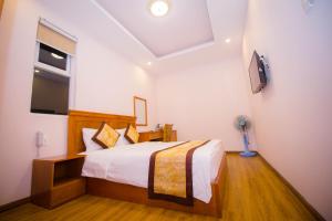 Katil atau katil-katil dalam bilik di Hồng Tùng Hotel