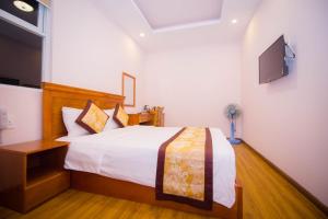 Katil atau katil-katil dalam bilik di Hồng Tùng Hotel