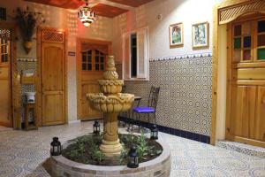 a fountain in the middle of a room at Riad Les Chtis D'Agadir in Agadir