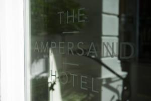 a sign that says the american hotel on a window at The Ampersand Hotel - Small Luxury Hotels of the World in London