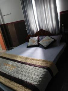 Giường trong phòng chung tại Nguyet Anh Guesthouse