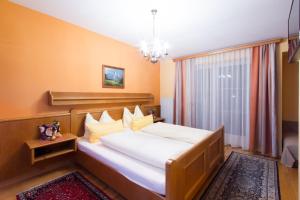 Voodi või voodid majutusasutuse Hotel Gasthof Brüggler toas