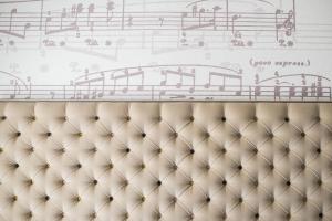 a drawing on the wall above a couch at The Ampersand Hotel - Small Luxury Hotels of the World in London