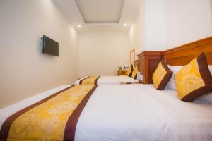 Katil atau katil-katil dalam bilik di Hồng Tùng Hotel