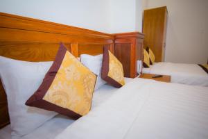 Katil atau katil-katil dalam bilik di Hồng Tùng Hotel
