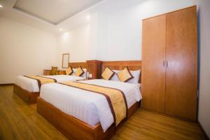 Katil atau katil-katil dalam bilik di Hồng Tùng Hotel