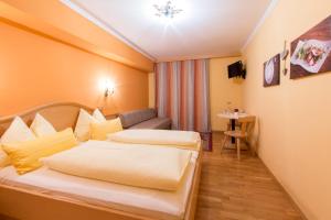 Voodi või voodid majutusasutuse Hotel Gasthof Brüggler toas