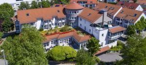 an overhead view of a large building with trees at Hotel Landhaus Feckl in Böblingen