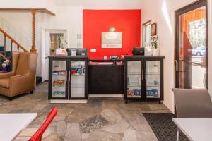 a room with two refrigerators and a red wall at Econo Lodge Inn & Suites Heavenly Village Area in South Lake Tahoe