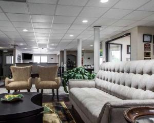a living room with a couch and chairs at Quality Inn in Florence