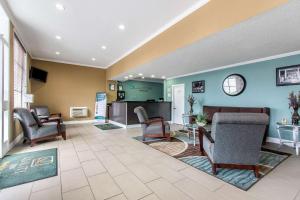 a lobby with chairs and a living room at Quality Inn Downtown Historic District in Mobile