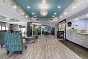 a lobby with chairs and a bar in a hospital at Quality Inn & Suites Montgomery East Carmichael Rd in Montgomery