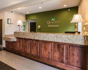 a hotel lobby with a reception counter with a waiting area at Quality Inn & Suites Birmingham - Highway 280 in Birmingham