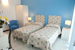 Postel nebo postele na pokoji v ubytování Hotel Venere